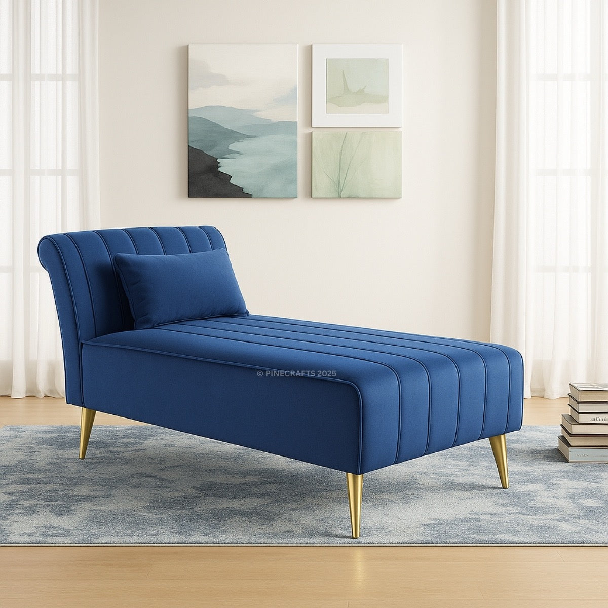 Blue tufted chaise lounge with gold legs in a room with light-colored walls and a rug.